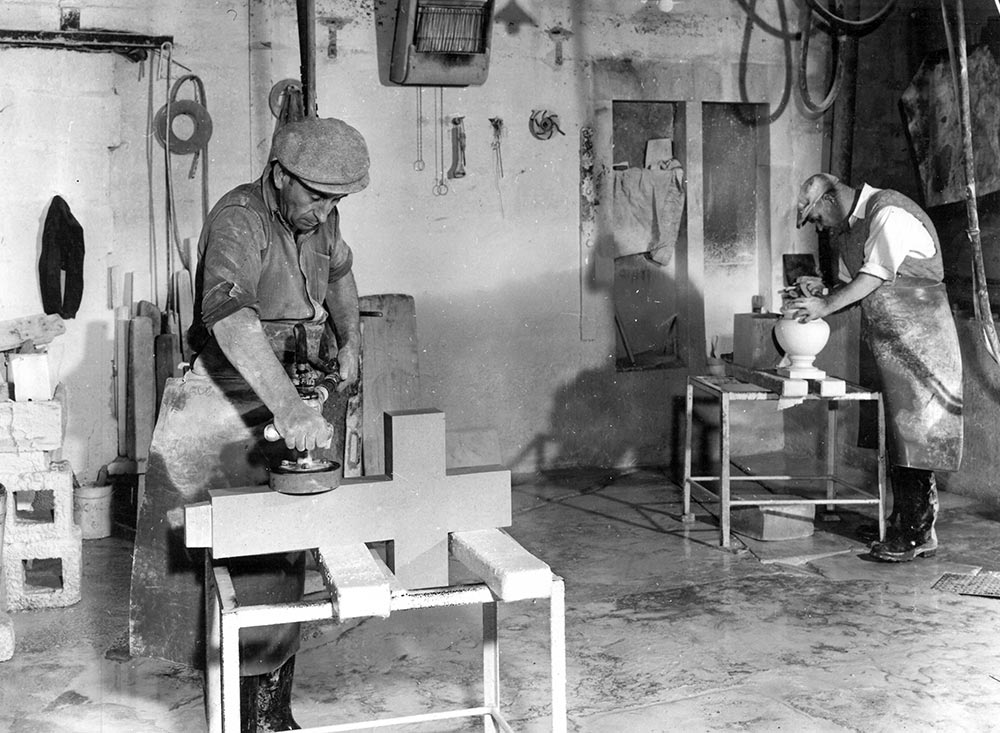Frank Wadham rubbing a Portland limestone memorial cross